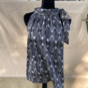 Ann Taylor LOFT open arm shirt.